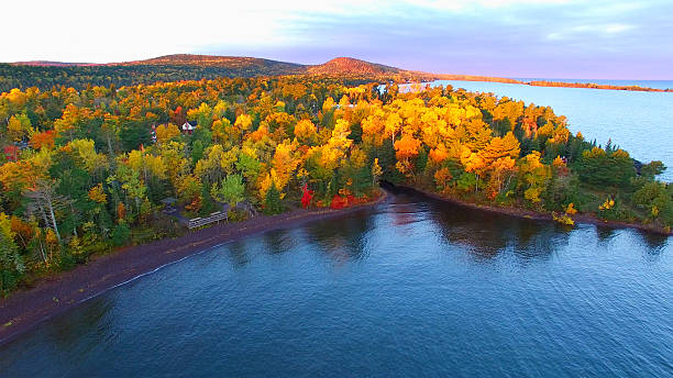 Vibrant autumn foliage along Thornapple Lake featuring colorful fall trees and scenic lake views.